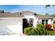 Beautiful home featuring a well-maintained lawn and vibrant tropical landscaping at 5078 47Th W St, Bradenton, FL 34210