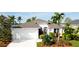 Lovely home showcasing lush landscaping, a well-kept lawn, and a two-car garage at 5078 47Th W St, Bradenton, FL 34210