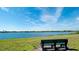 Scenic view of the lake with a bench to enjoy the serene surroundings at 5078 47Th W St, Bradenton, FL 34210