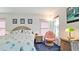 Charming main bedroom featuring wicker accents, a cozy chair, and serene decor for a relaxing retreat at 5078 47Th W St, Bradenton, FL 34210