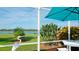 Enclosed patio seating area with lawn and river view at 5078 47Th W St, Bradenton, FL 34210