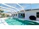 Enclosed pool with patio seating and access to the home at 5078 47Th W St, Bradenton, FL 34210
