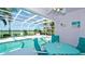 Enclosed pool with dining area and access to the home at 5078 47Th W St, Bradenton, FL 34210