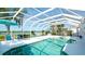 Enclosed pool with spa, lounge seating, lawn and river view at 5078 47Th W St, Bradenton, FL 34210