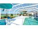 Enclosed pool with spa, lounge seating, lawn and river view at 5078 47Th W St, Bradenton, FL 34210