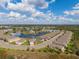 An aerial view of the community with a pond and fountain in the background, with the home location marked at 5301 Shell Mound Cir, Punta Gorda, FL 33982