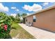 Picturesque backyard with patio, complete with grill, cozy seating, and manicured landscaping at 5301 Shell Mound Cir, Punta Gorda, FL 33982