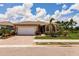 Charming single-story home featuring a brick driveway and well-maintained landscaping at 5301 Shell Mound Cir, Punta Gorda, FL 33982