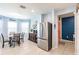 Open concept kitchen with stainless steel refrigerator and an adjacent dining space at 5301 Shell Mound Cir, Punta Gorda, FL 33982
