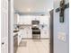 Spacious kitchen with white cabinets, stainless steel appliances, and a modern backsplash at 5301 Shell Mound Cir, Punta Gorda, FL 33982