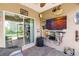 Outdoor lanai features stylish brick flooring, a ceiling fan, and a screened-in view of lush greenery at 5301 Shell Mound Cir, Punta Gorda, FL 33982