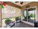 Inviting outdoor patio with wicker chairs, shades, and serene views, perfect for relaxation at 5301 Shell Mound Cir, Punta Gorda, FL 33982