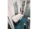 Modern bathroom featuring a freestanding tub, blue tile floors, and glass shower at 5402 Chateau Ln, Bradenton, FL 34207