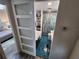 Modern bathroom featuring blue tile floors, a bathtub and a glass enclosed shower at 5402 Chateau Ln, Bradenton, FL 34207