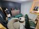 Contemporary bedroom/office space with modern decor, a dark accent wall, and flexible furniture layouts at 5402 Chateau Ln, Bradenton, FL 34207
