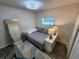 Inviting bedroom with a double bed, fashionable chair, and laminate floors brightened by natural light at 5402 Chateau Ln, Bradenton, FL 34207