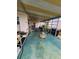 Relaxing, covered carport area with comfortable seating and ample space at 5402 Chateau Ln, Bradenton, FL 34207