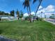 Charming home on a well-manicured lawn with mature trees and vibrant landscaping at 5402 Chateau Ln, Bradenton, FL 34207