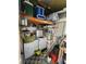 Compact laundry area with washer, dryer, shelving, and additional storage space above at 5402 Chateau Ln, Bradenton, FL 34207