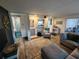 Relaxing living room featuring a comfortable sectional sofa, area rug and modern decor at 5402 Chateau Ln, Bradenton, FL 34207