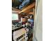 Cluttered storage shed with tools, equipment, and various household items neatly stacked at 5402 Chateau Ln, Bradenton, FL 34207
