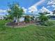 Home with well-maintained lawn, flowering vines and tropical landscaping at 5402 Chateau Ln, Bradenton, FL 34207