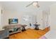 Bedroom with a stackable washer and dryer and a TV on a bureau at 6016 Hibiscus Dr, Bradenton, FL 34207