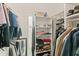 Organized walk-in closet with ample storage, keeping clothes tidy and accessible at 6016 Hibiscus Dr, Bradenton, FL 34207