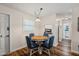 Cozy dining room with hardwood floors and seating for four at 6016 Hibiscus Dr, Bradenton, FL 34207