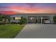 Charming single-story home featuring a covered carport and well-maintained landscaping at 6016 Hibiscus Dr, Bradenton, FL 34207