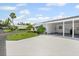 Well-maintained single-story home with a carport and manicured lawn at 6016 Hibiscus Dr, Bradenton, FL 34207