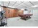 Spacious recreation room with pool table, exercise equipment, and ample storage at 6016 Hibiscus Dr, Bradenton, FL 34207