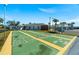 Active shuffleboard court, set amidst palm trees and well-maintained lawns at 6016 Hibiscus Dr, Bradenton, FL 34207