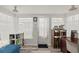 Bright sunroom with many windows, bookshelves, light walls, and hardwood-style flooring at 6016 Hibiscus Dr, Bradenton, FL 34207