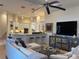 Inviting living room with a modern design, comfortable seating, and an open floor plan to the kitchen at 624 Mourning Dove Dr, Sarasota, FL 34236