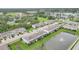 Aerial view of a community with manicured lawns, water features and beautiful Florida landscape at 6454 Baytown Dr, Sarasota, FL 34240