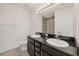 Bathroom with a dual sink vanity, granite countertop, and walk-in shower with glass door at 6454 Baytown Dr, Sarasota, FL 34240