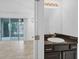 Well-lit bathroom featuring a vanity with a dark countertop and access to the patio at 6454 Baytown Dr, Sarasota, FL 34240