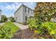 Side view of a two-story home with neatly landscaped grounds at 6454 Baytown Dr, Sarasota, FL 34240