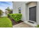 Front exterior features a well-manicured lawn and a view of the fountain at 6454 Baytown Dr, Sarasota, FL 34240