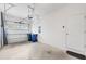 A two-car garage features white-painted walls and concrete flooring at 6454 Baytown Dr, Sarasota, FL 34240