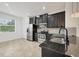 Modern kitchen featuring stainless steel appliances and dark cabinets at 6454 Baytown Dr, Sarasota, FL 34240