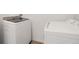 Laundry room featuring a new Samsung washer and dryer with light walls and tiled floors at 6454 Baytown Dr, Sarasota, FL 34240