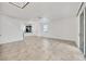 Bright open living space with tiled floors, ceiling fan, and sliding glass doors to the outdoors at 6454 Baytown Dr, Sarasota, FL 34240