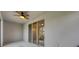 Covered patio with ceiling fan and sliding glass doors at 6454 Baytown Dr, Sarasota, FL 34240