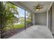 Screened-in patio with picturesque views of the lake and fountain at 6454 Baytown Dr, Sarasota, FL 34240