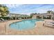 Inviting community pool area with lounge chairs, tables, and a covered pavilion at 6454 Baytown Dr, Sarasota, FL 34240