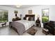 Bright bedroom with neutral decor, tile floors, and large windows providing natural light at 6504 Heritage Ln # 99, Bradenton, FL 34209