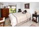 Cozy bedroom features comfortable bedding, natural light, and a calming color scheme at 6504 Heritage Ln # 99, Bradenton, FL 34209