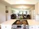 Modern kitchen with stainless steel appliances, stone countertops, and an open layout to living areas at 6504 Heritage Ln # 99, Bradenton, FL 34209